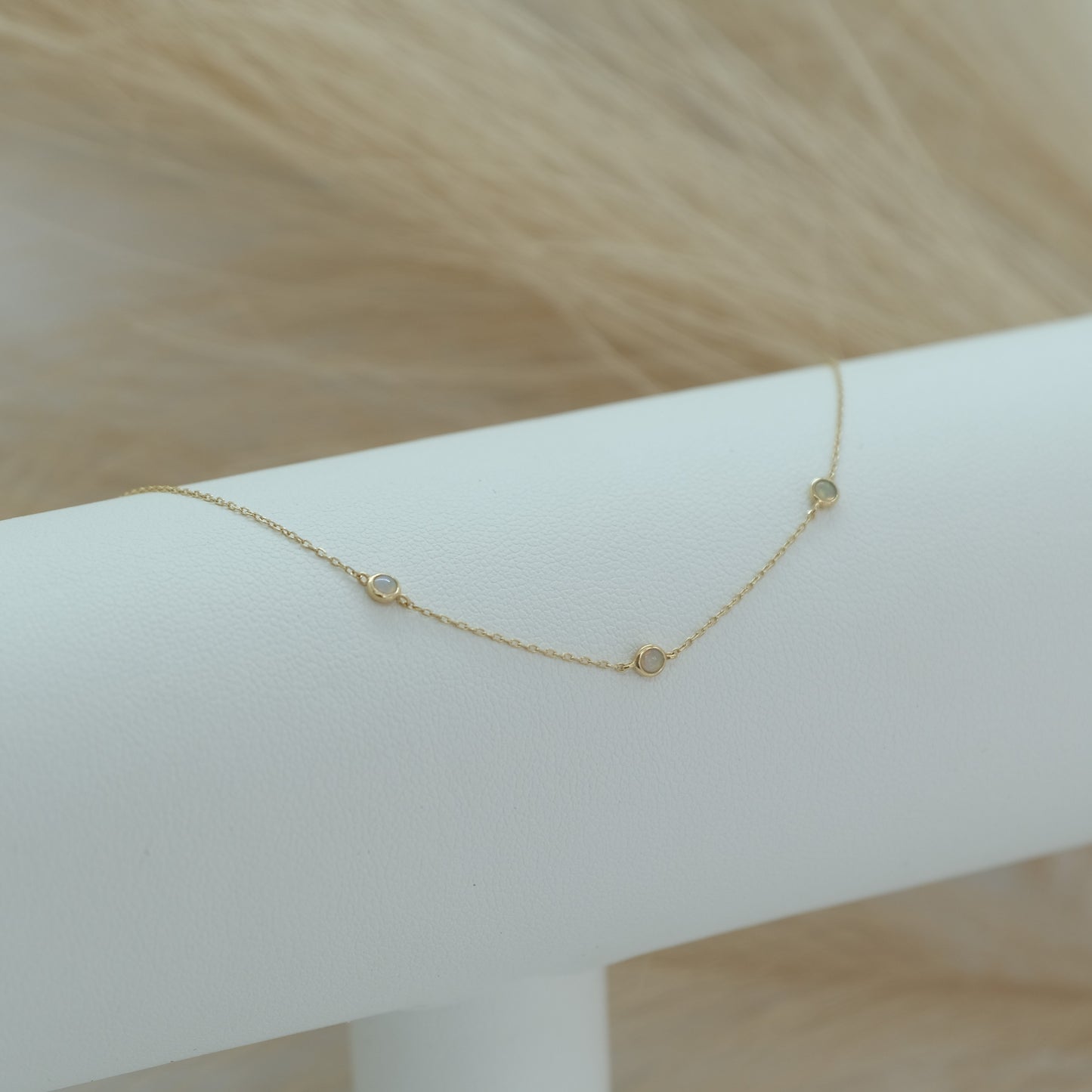14ct Opal Bracelet from Ella Ray Jewellery: Elegant bracelet crafted from 14ct gold, featuring radiant opal gemstones, perfect for adding a touch of iridescent beauty and sophistication to your wrist.