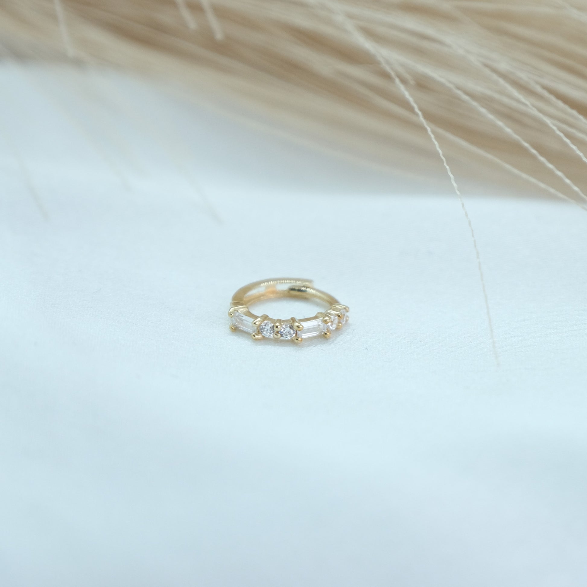 9ct Baguette Gem Huggies from Ella Ray Jewellery: Elegant, versatile huggie earrings crafted from 9ct gold with sparkling baguette-cut gems in a variety of colors, perfect for everyday glamour.