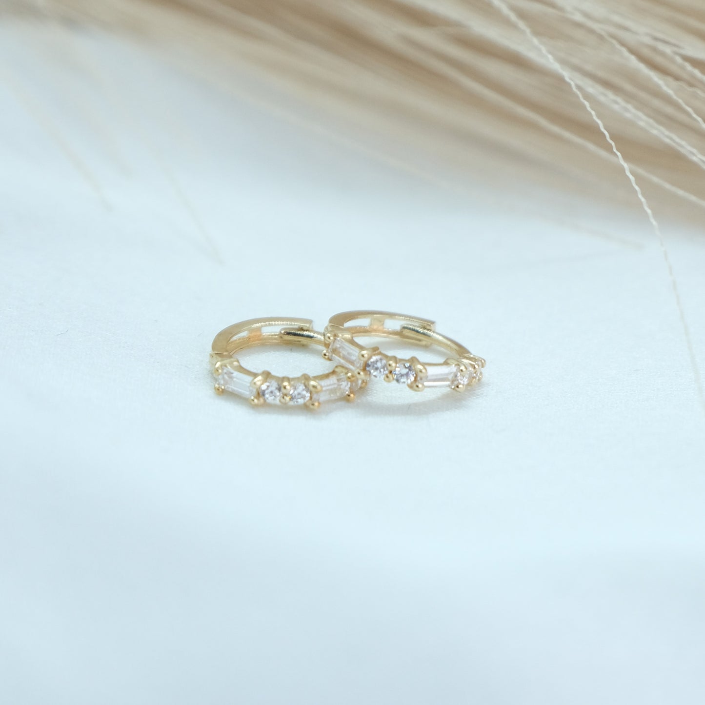 9ct Baguette Gem Huggies from Ella Ray Jewellery: Elegant, versatile huggie earrings crafted from 9ct gold with sparkling baguette-cut gems in a variety of colors, perfect for everyday glamour.