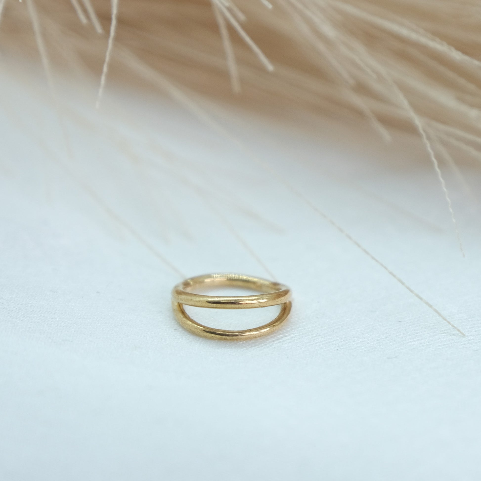 9ct Gold Double Band Hinge Ring showcasing a stylish double band design with a hinge mechanism for a modern and sophisticated look. Perfect for adding a chic touch to any outfit.