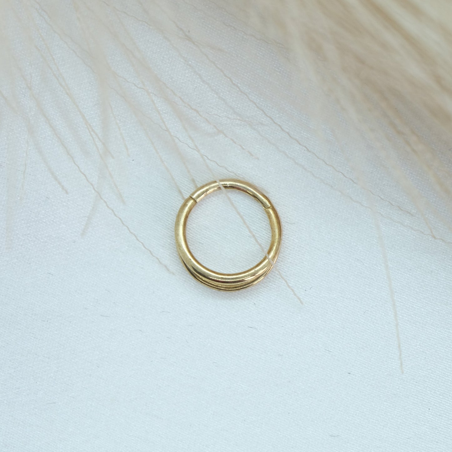 9ct Gold Double Band Hinge Ring showcasing a stylish double band design with a hinge mechanism for a modern and sophisticated look. Perfect for adding a chic touch to any outfit.