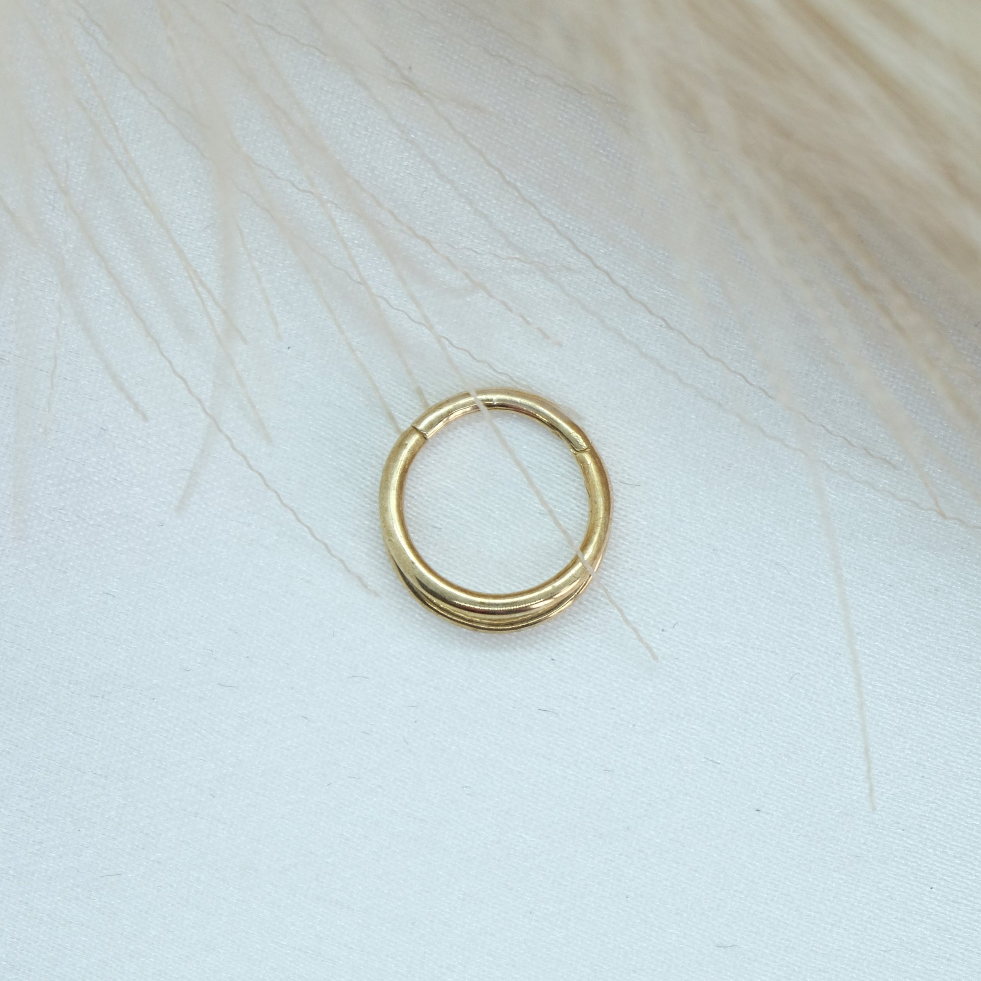 9ct Gold Double Band Hinge Ring showcasing a stylish double band design with a hinge mechanism for a modern and sophisticated look. Perfect for adding a chic touch to any outfit.