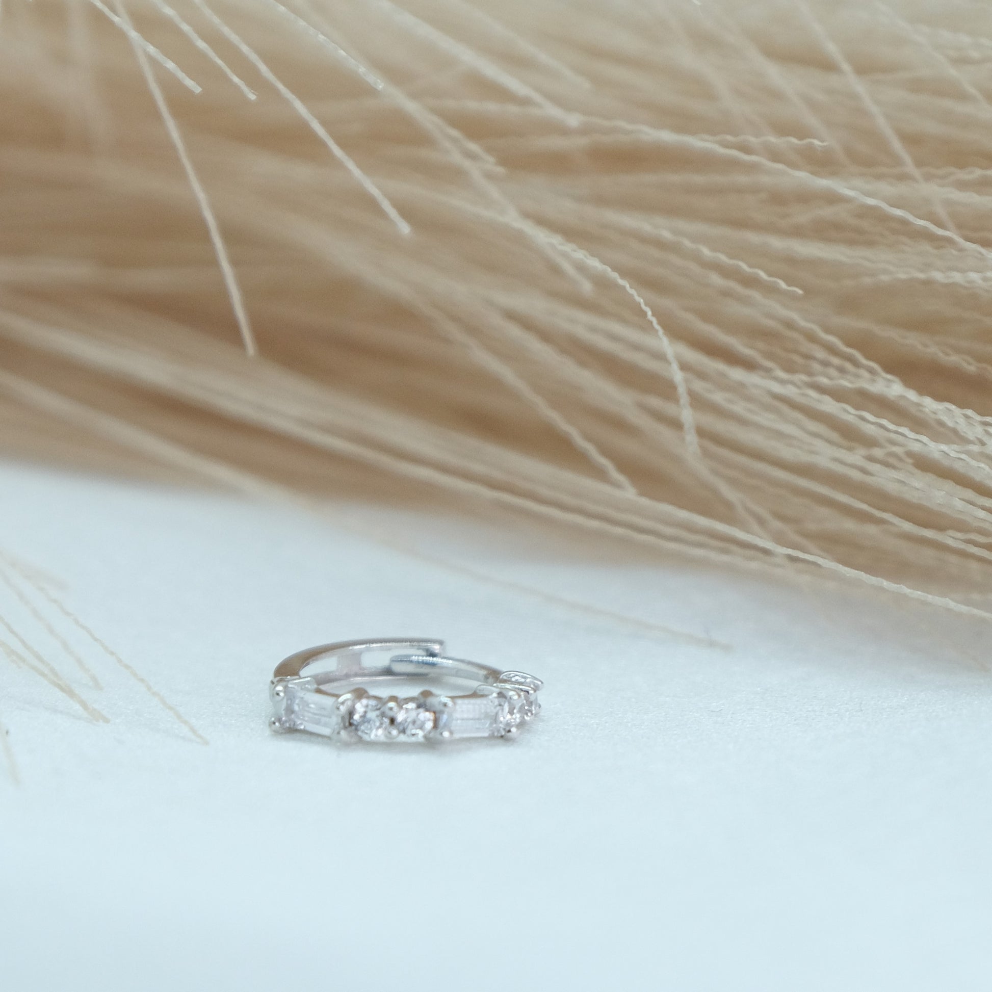 9ct Baguette Gem Huggies from Ella Ray Jewellery: Elegant, versatile huggie earrings crafted from 9ct gold with sparkling baguette-cut gems in a variety of colors, perfect for everyday glamour.