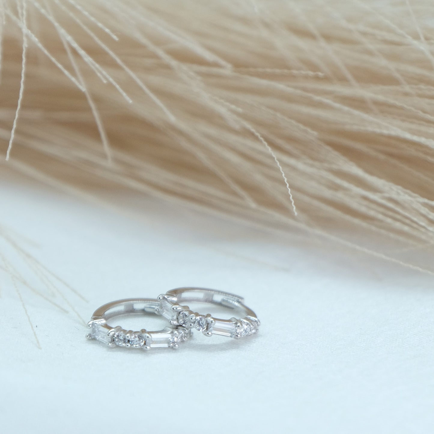 9ct Baguette Gem Huggies from Ella Ray Jewellery: Elegant, versatile huggie earrings crafted from 9ct gold with sparkling baguette-cut gems in a variety of colours, perfect for everyday glamour.