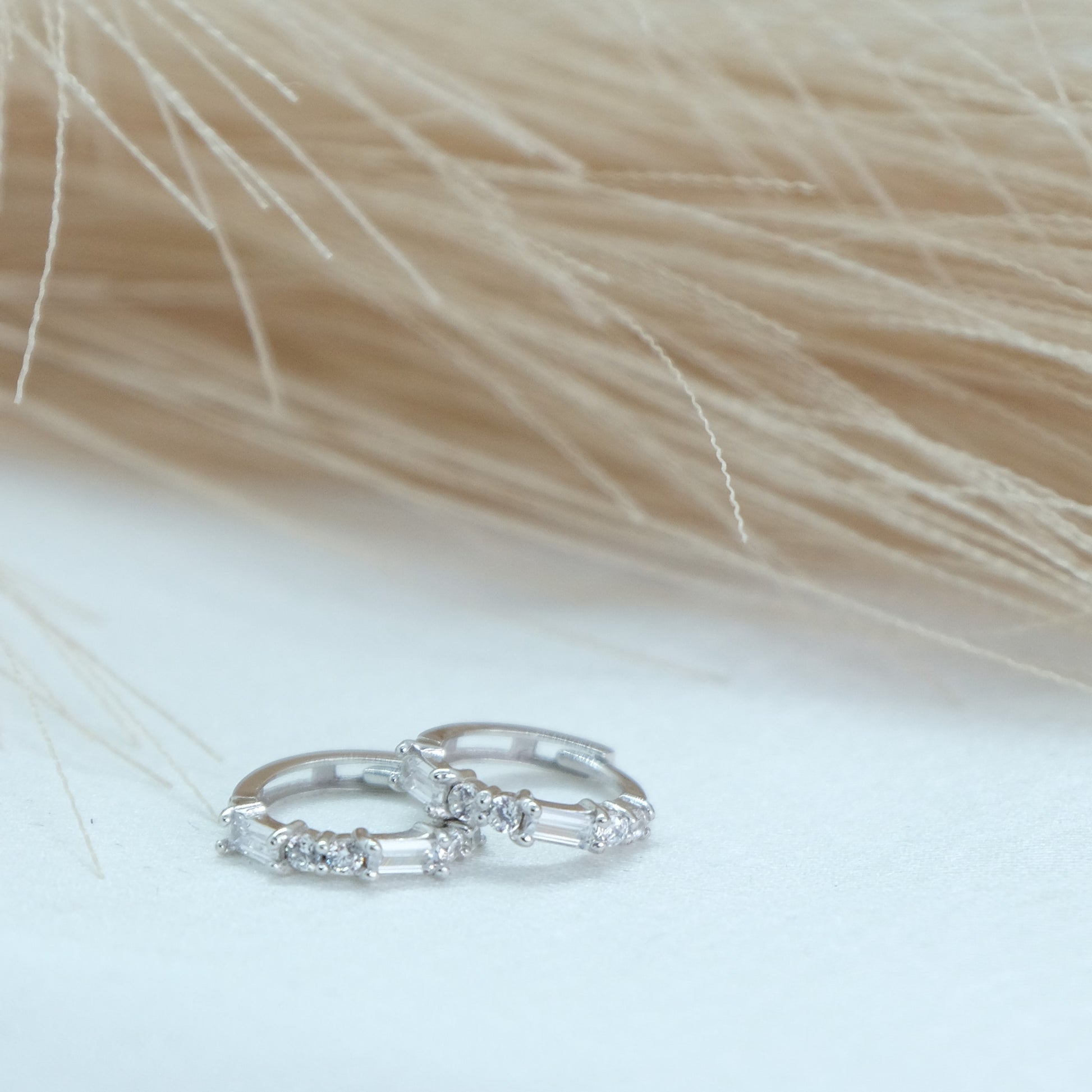 9ct Baguette Gem Huggies from Ella Ray Jewellery: Elegant, versatile huggie earrings crafted from 9ct gold with sparkling baguette-cut gems in a variety of colors, perfect for everyday glamour.