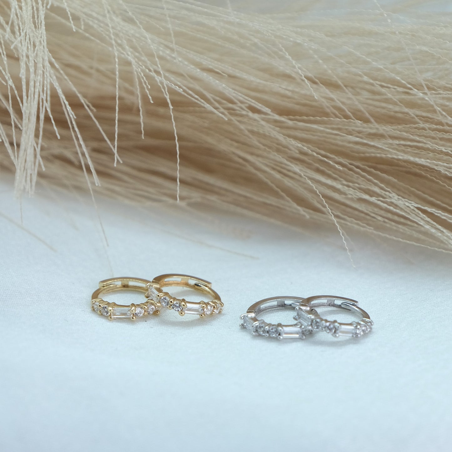 9ct Baguette Gem Huggies from Ella Ray Jewellery: Elegant, versatile huggie earrings crafted from 9ct gold with sparkling baguette-cut gems in a variety of colors, perfect for everyday glamour.